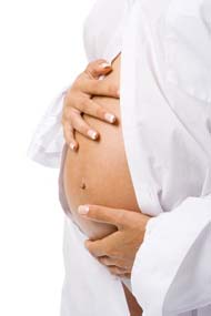 pregnant woman holding her belly over white background